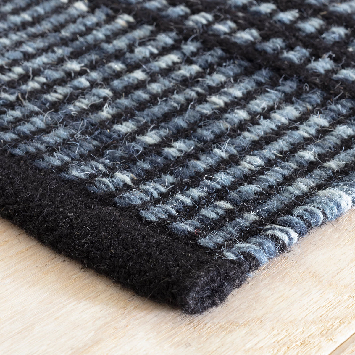 Dash & Albert Malta Handwoven Wool Rug in Navy, corner detail