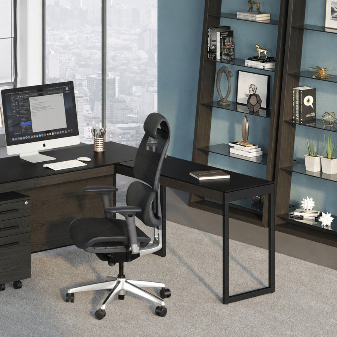 BDi Sequel 20 6112 Desk Extension in Charcoal Stained Ash, with a black frame, joined to the desk with a mobile file, in an office with tall windows