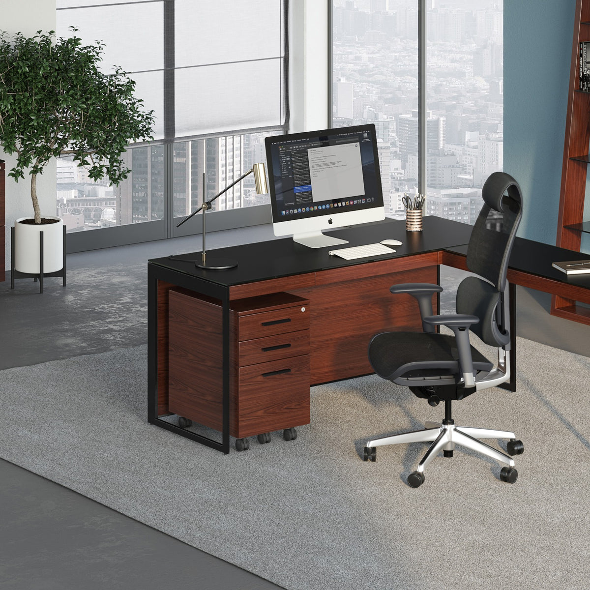 BDi Sequel 20 6101 Desk in Chocolate Stained Walnut, with a black frame, return and mobile file, in an office