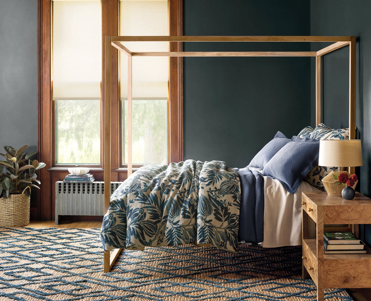 Dash & Albert Marco Jute Soumak Handwoven Rug in Navy, bedroom setting