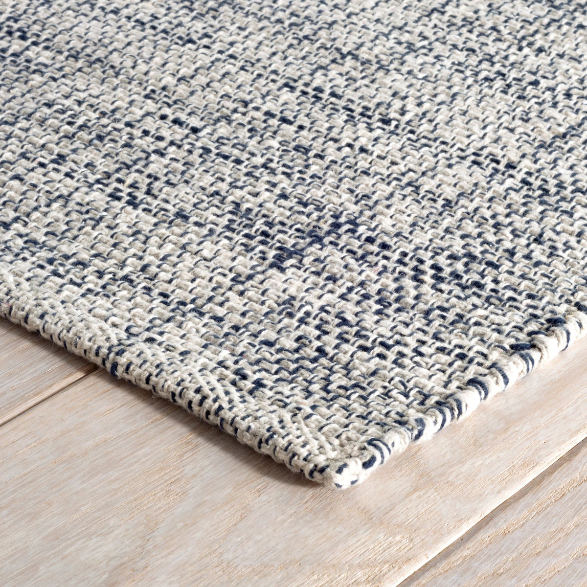 Dash & Albert Marled Handwoven Cotton Rug in Indigo, corner detail