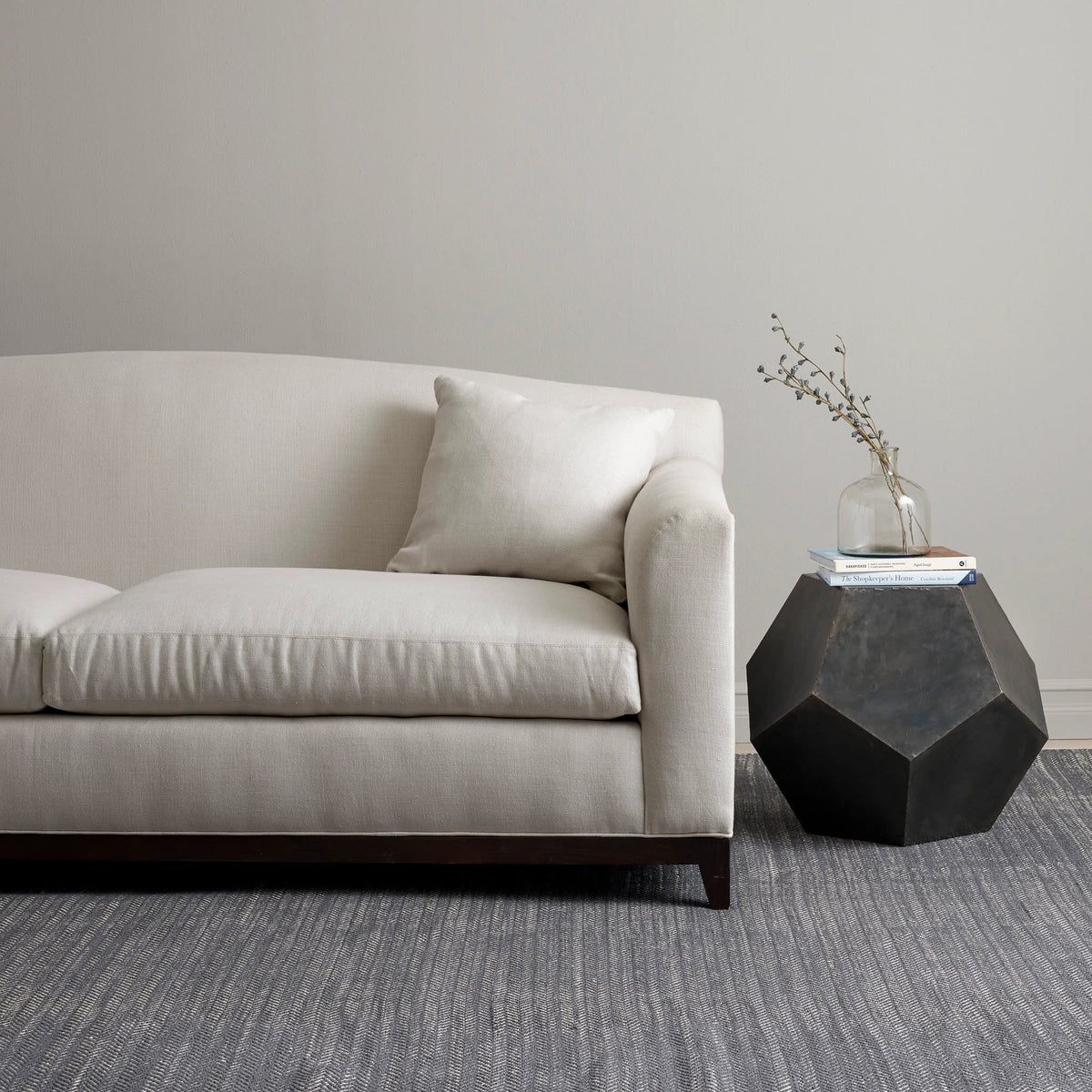 Dash & Albert Herringbone Handwoven Indoor/Outdoor Rug in Shale / White, living room setting