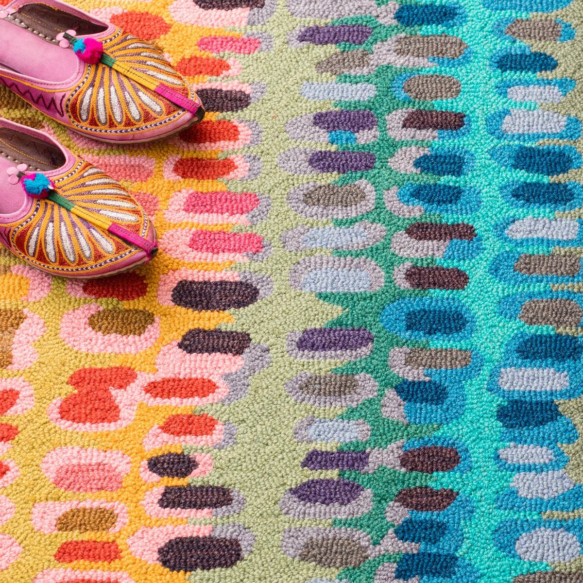 Dash & Albert Paint Chip Hand Micro Hooked Wool Rug in Multicolour, close-up with slippers