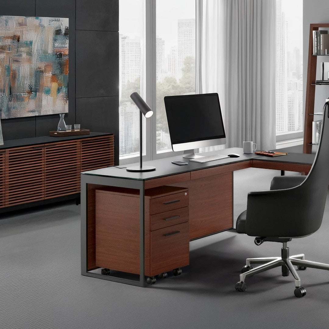 BDi Sequel 20 6101 Desk in Chocolate Stained Walnut, with a black frame, return and mobile file, in an office