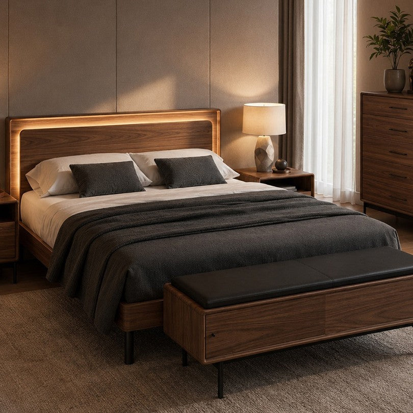 BDi Linq Up-Linq Bed in Natural Walnut, queen, in a bedroom at night with a bench and chest