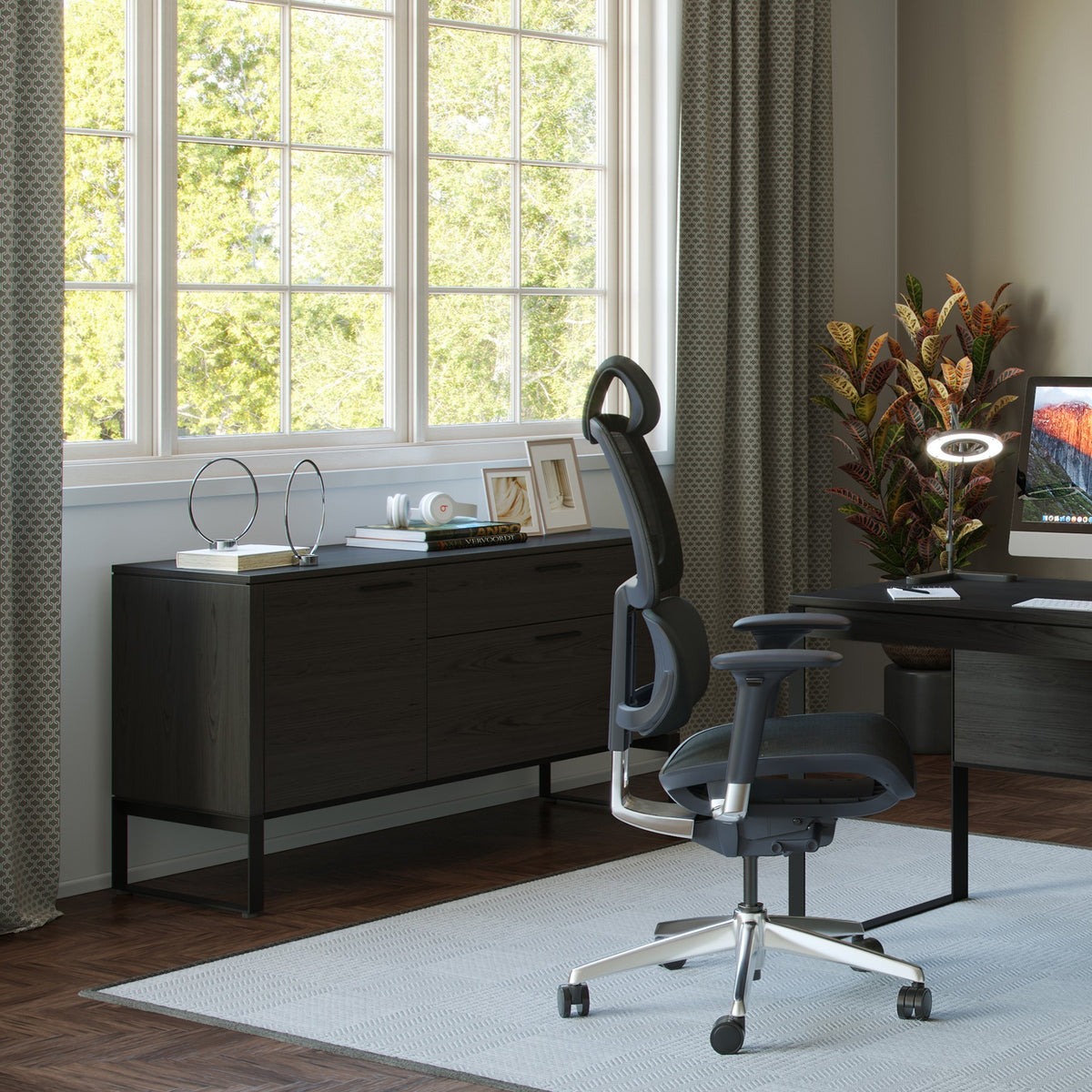 BDi Linea 6220 Multi Function Cabinet in Charcoal Stained Ash, in a home office with a desk and bookcase