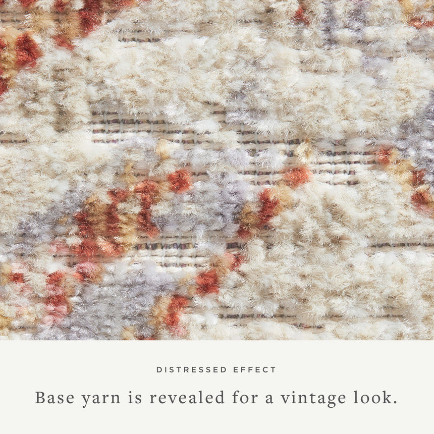 Textured fabric with a distressed effect, showing base yarn for a vintage look.