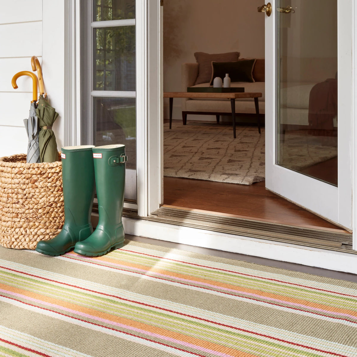 Dash & Albert Stone Soup Handwoven Indoor/Outdoor Rug in Multi, doorstep setting