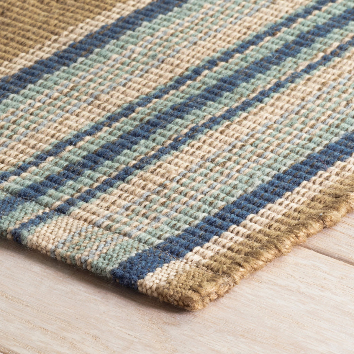 Dash & Albert Heron Stripe Handwoven Indoor/Outdoor Rug in Blue, corner detail