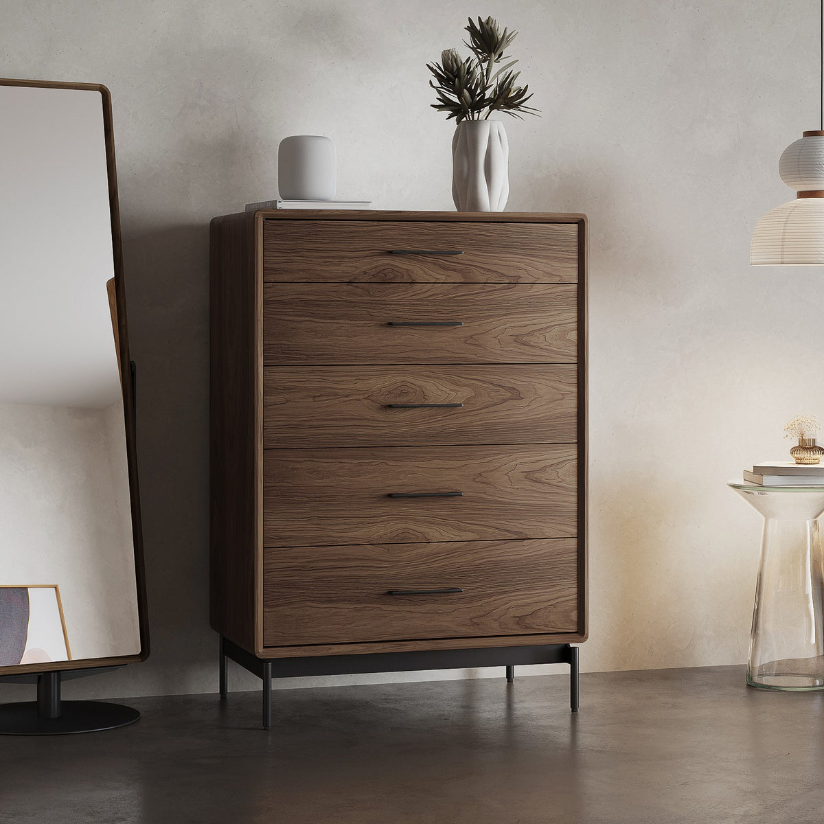 BDi Linq 9185 5 Drawer Chest in Natural Walnut, beside a floor mirror in a bedroom