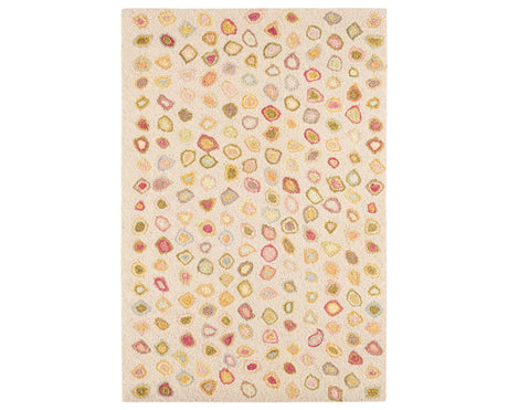 Rug with a Cat's Paw Hand Micro Hooked pattern on a plain background