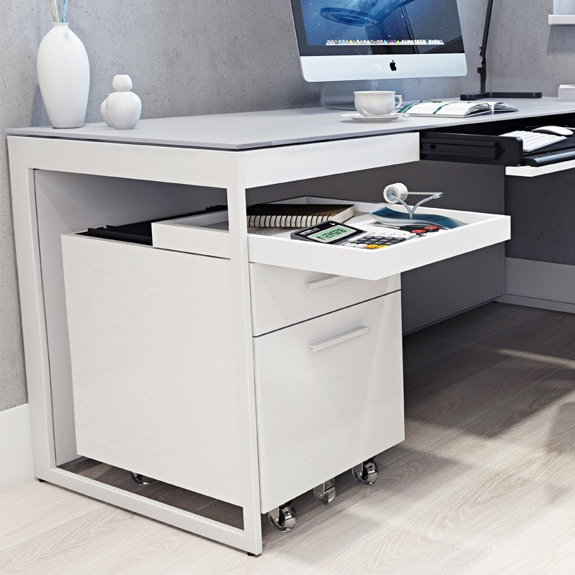 BDi Centro 6407 Mobile File Pedestal in Satin White on Oak, tray pulled out under a desk, in an office