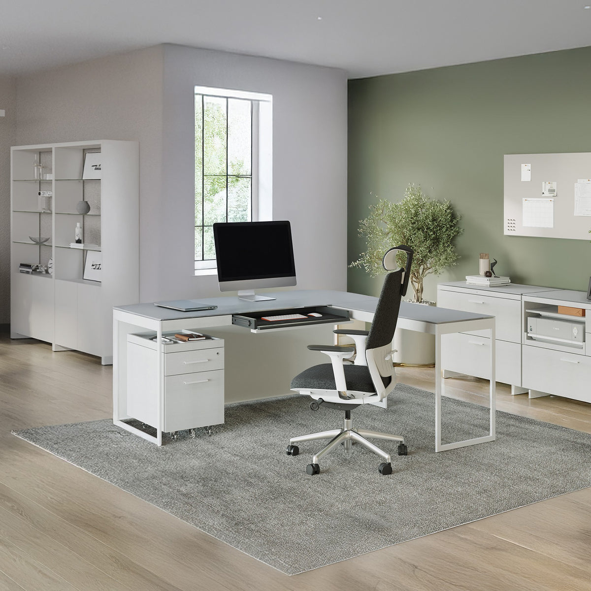 BDi Centro 6402 Desk Extension in Satin White on Oak with Grey Glass, joined to a desk, in an open office
