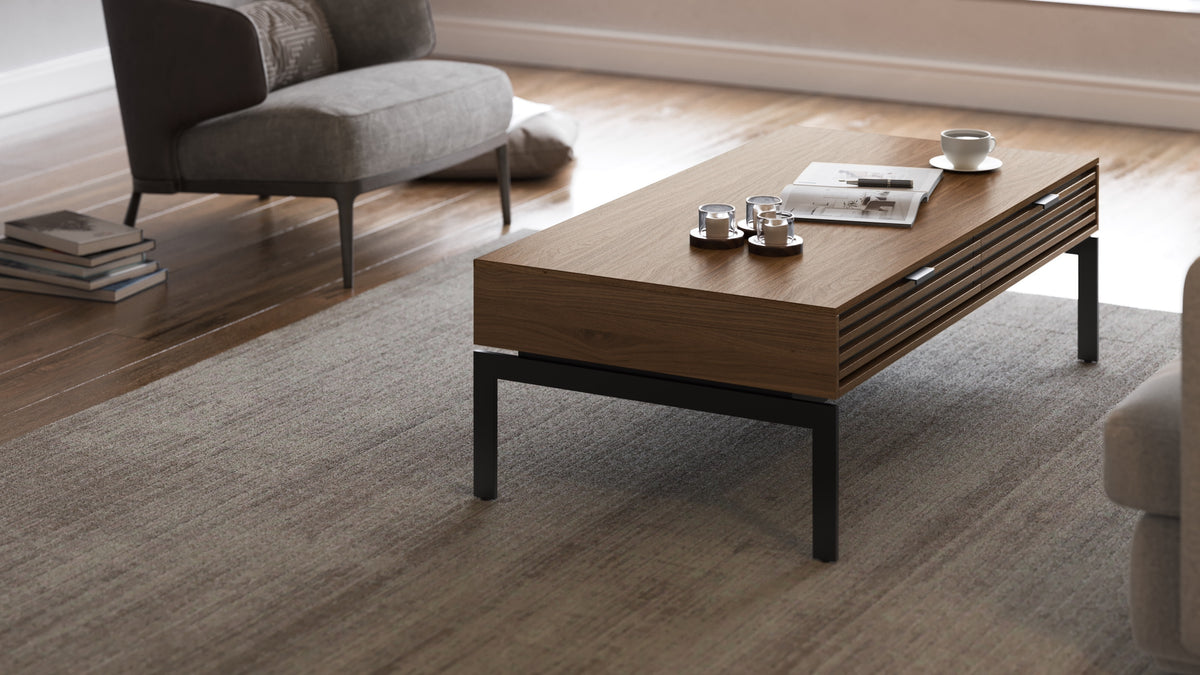 BDi Cora 1172 Coffee Table in Natural Walnut, in a living room with a lounge chair
