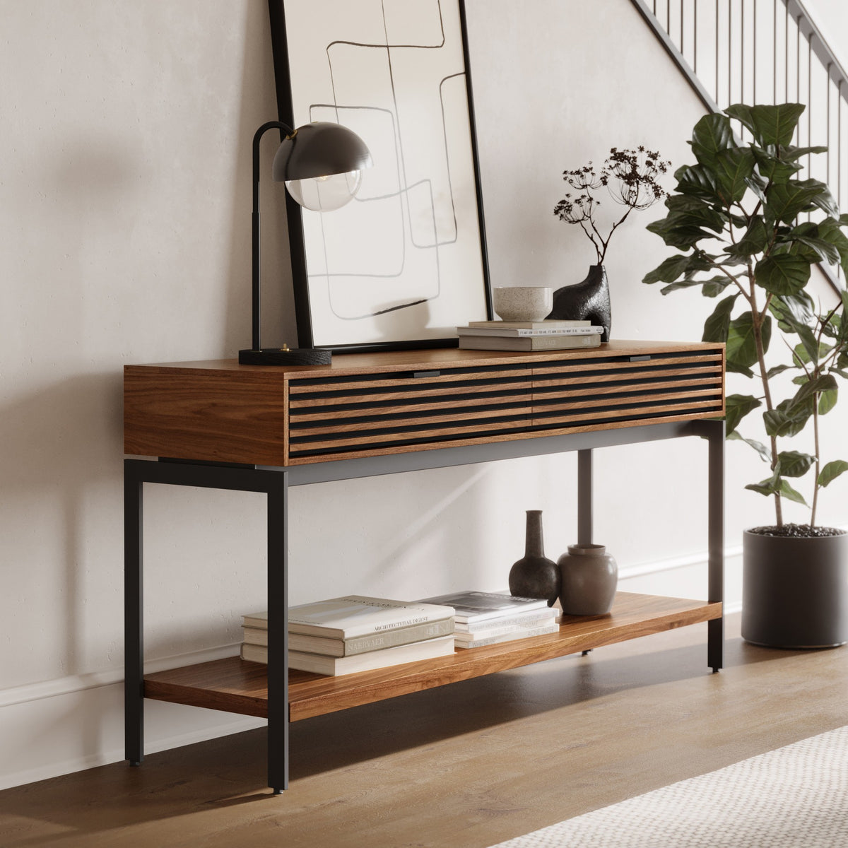 BDi Cora 1173 Console Table in Natural Walnut, angled view in an entryway by the stairs