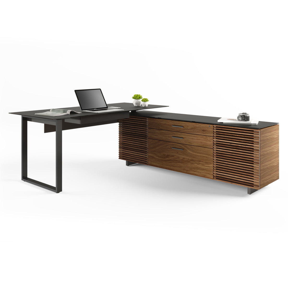 BDi Corridor 6531 L-Shaped Office Desk in Natural Walnut, angled view with a laptop, on white