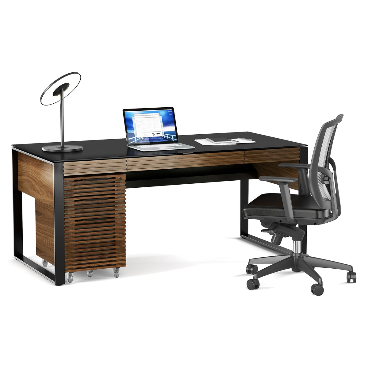 BDi Corridor 6521 Executive Office Desk in Natural Walnut, angled view with a file pedestal and chair, on white