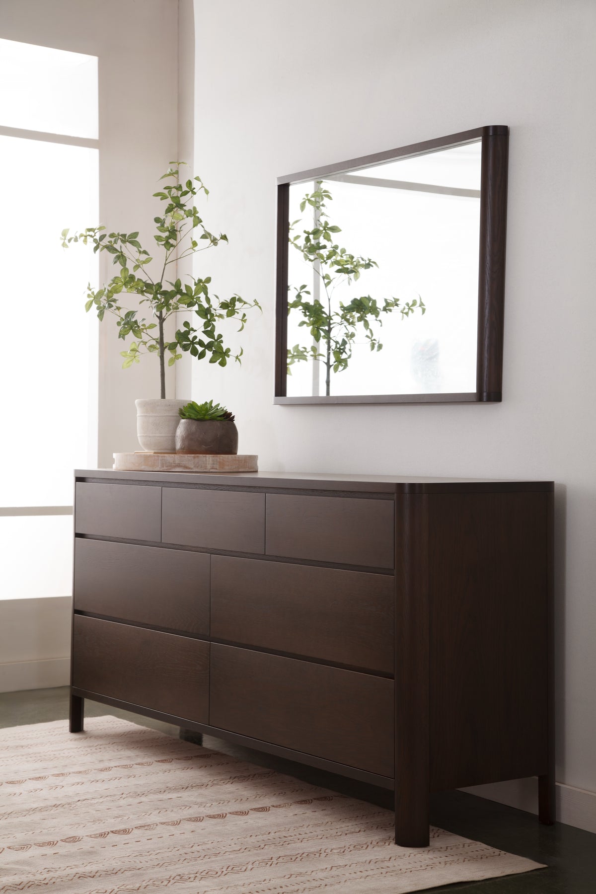 West Bros Curva Dresser in 22 Mocha, with the Curva mirror, in a room setting