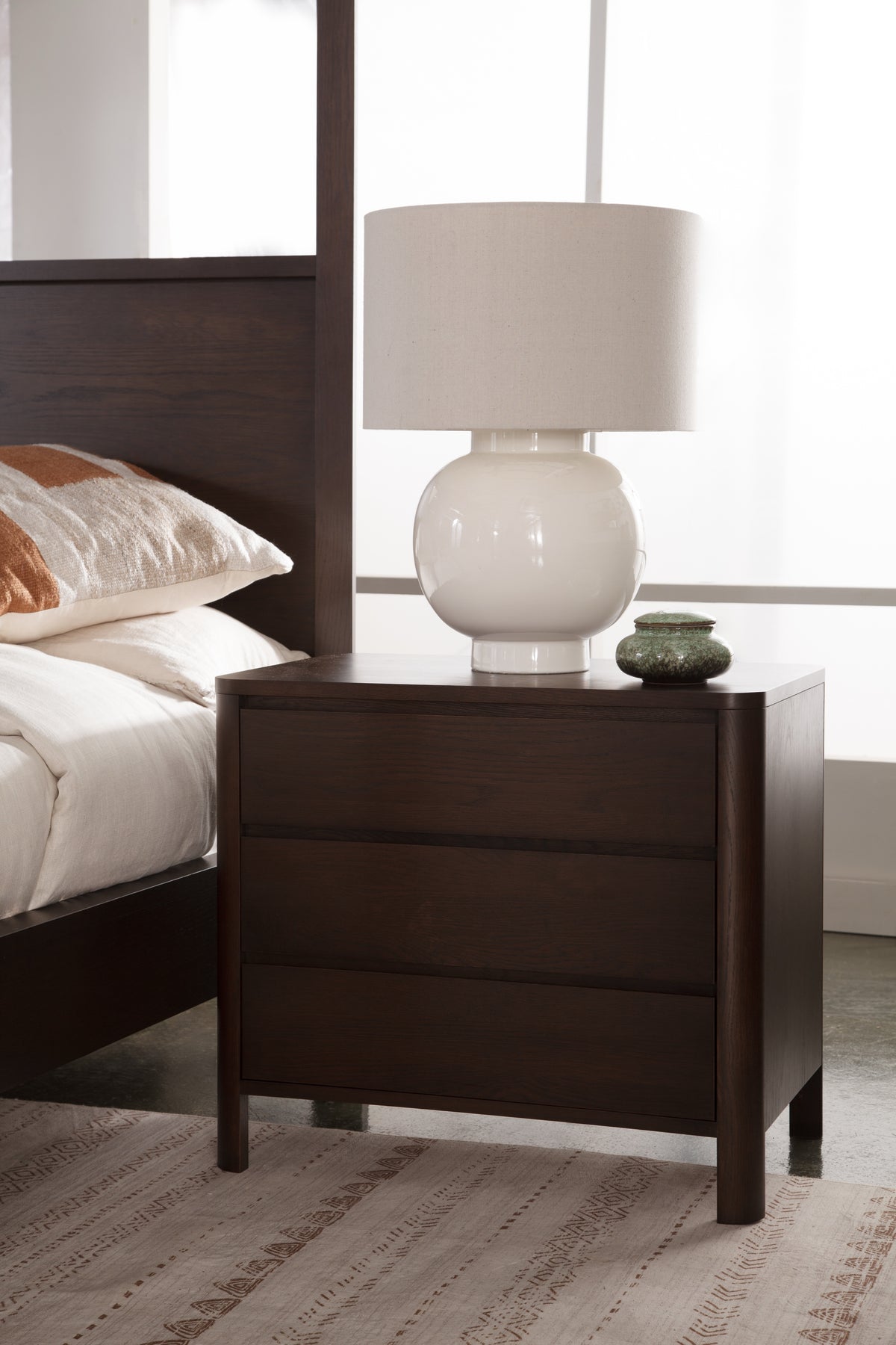 West Bros Curva Bedside Chest in 22 Mocha, in a room setting