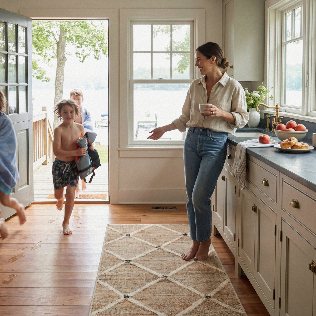 Dash & Albert Kali Machine Washable Rug in Natural, kitchen setting