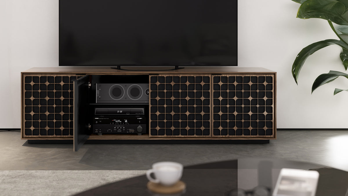 BDi Elements 8703 Media + Storage Cabinet in Natural Walnut, one door open with media equipment, in a living room, with Constellation door fronts