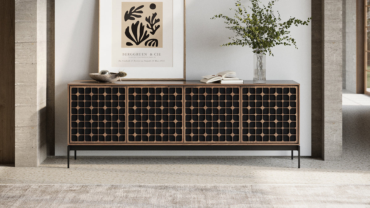 BDi Elements 8709 Media + Storage Console in Natural Walnut, front view under a framed print, with Constellation door fronts