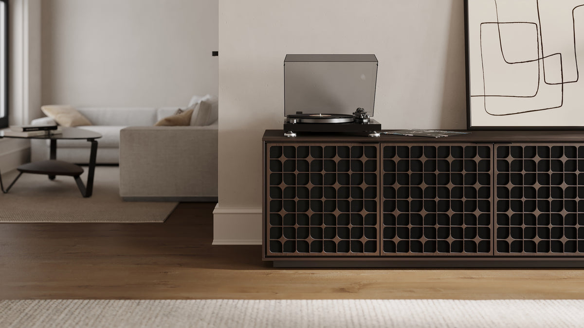 BDi Elements 8703 Media + Storage Cabinet in Toasted Oak, with a turntable, in a living room, with Constellation door fronts