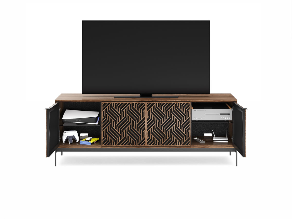 BDi Elements 8709 Media + Storage Console in Natural Walnut, outer doors open with a TV and game consoles, on white, with Weave door fronts