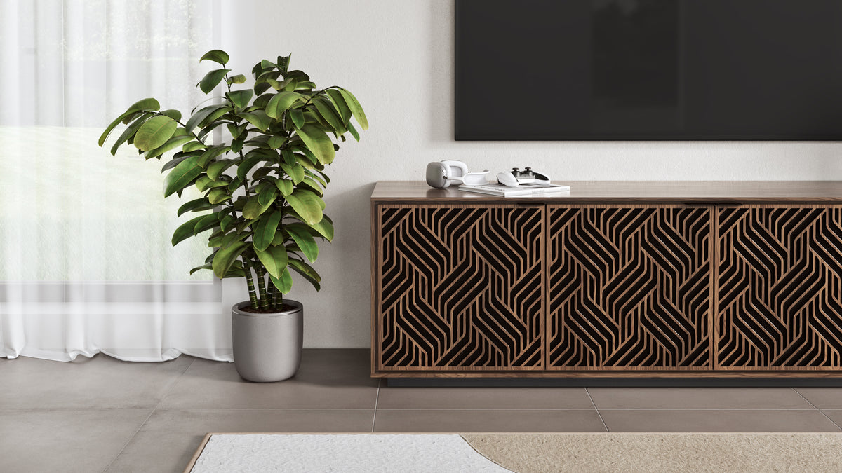 BDi Elements 8703 Media + Storage Cabinet in Natural Walnut, under a TV, beside a plant, with Weave door fronts