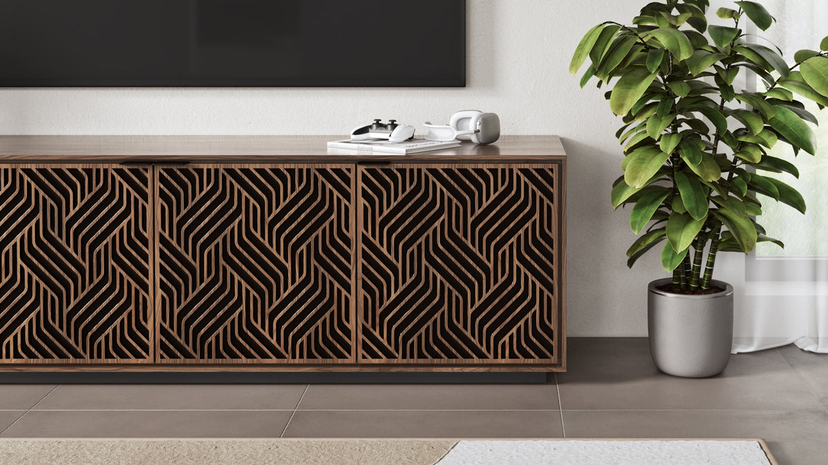 BDi Elements 8703 Media + Storage Cabinet in Natural Walnut, close view under a TV, beside a plant, with Weave door fronts
