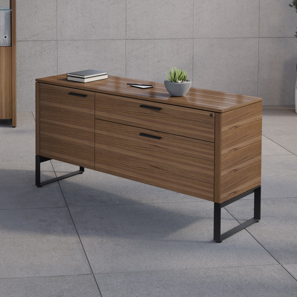 BDi Linea 6220 Multi Function Cabinet in Natural Walnut, in an office with a matching bookcase