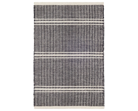 Rug with a Malta Handwoven pattern on a plain background