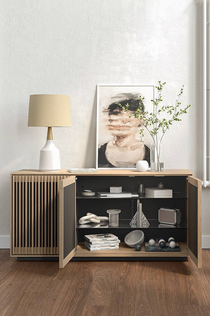 BDi Profile 8477 3-Door Media & Storage Console in Washed Oak, two doors open, in a living room with a lamp