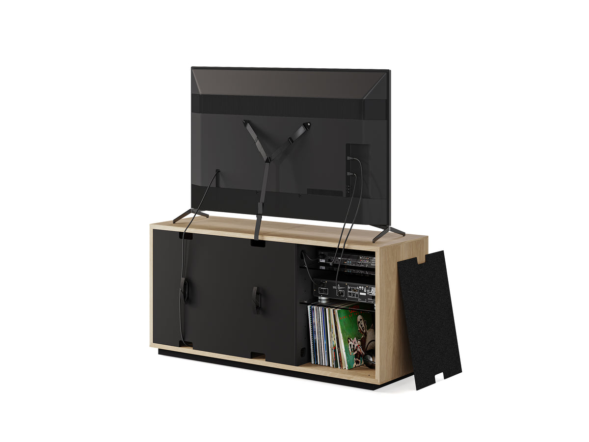 BDi Profile 8477 3-Door Media & Storage Console in Washed Oak, back view with a TV and a rear panel off, on white