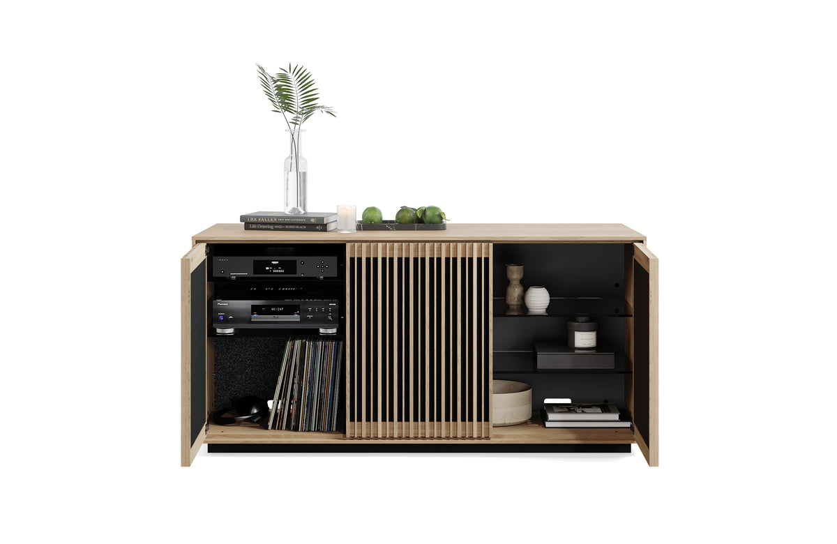 BDi Profile 8477 3-Door Media & Storage Console in Washed Oak, outer doors open with media equipment and decor, on white