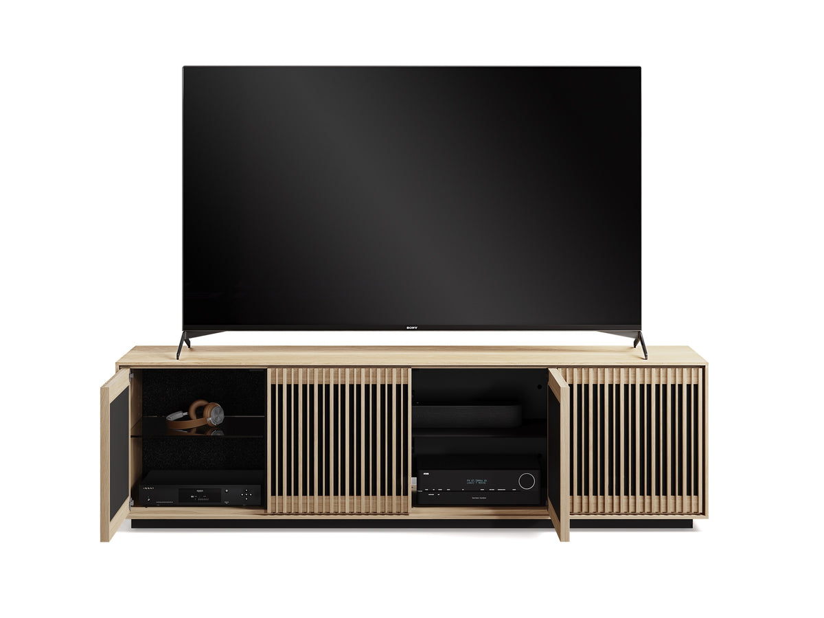 BDi Profile 8479 4-Door Media & Storage Console in Washed Oak, two doors open with a TV and media equipment, on white