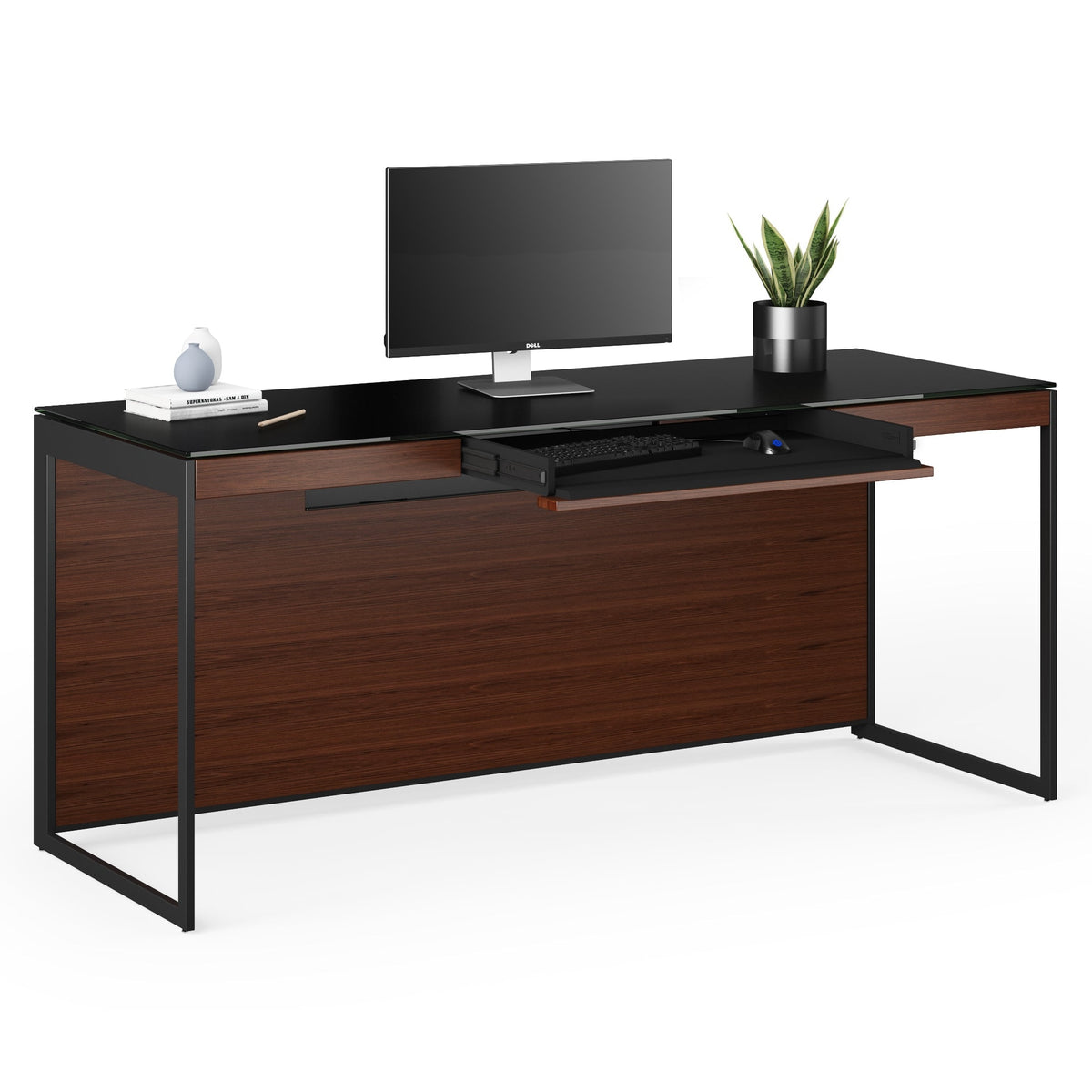 BDi Sequel 20 6101 Desk in Chocolate Stained Walnut, with a black frame, keyboard drawer open, with a monitor, on white