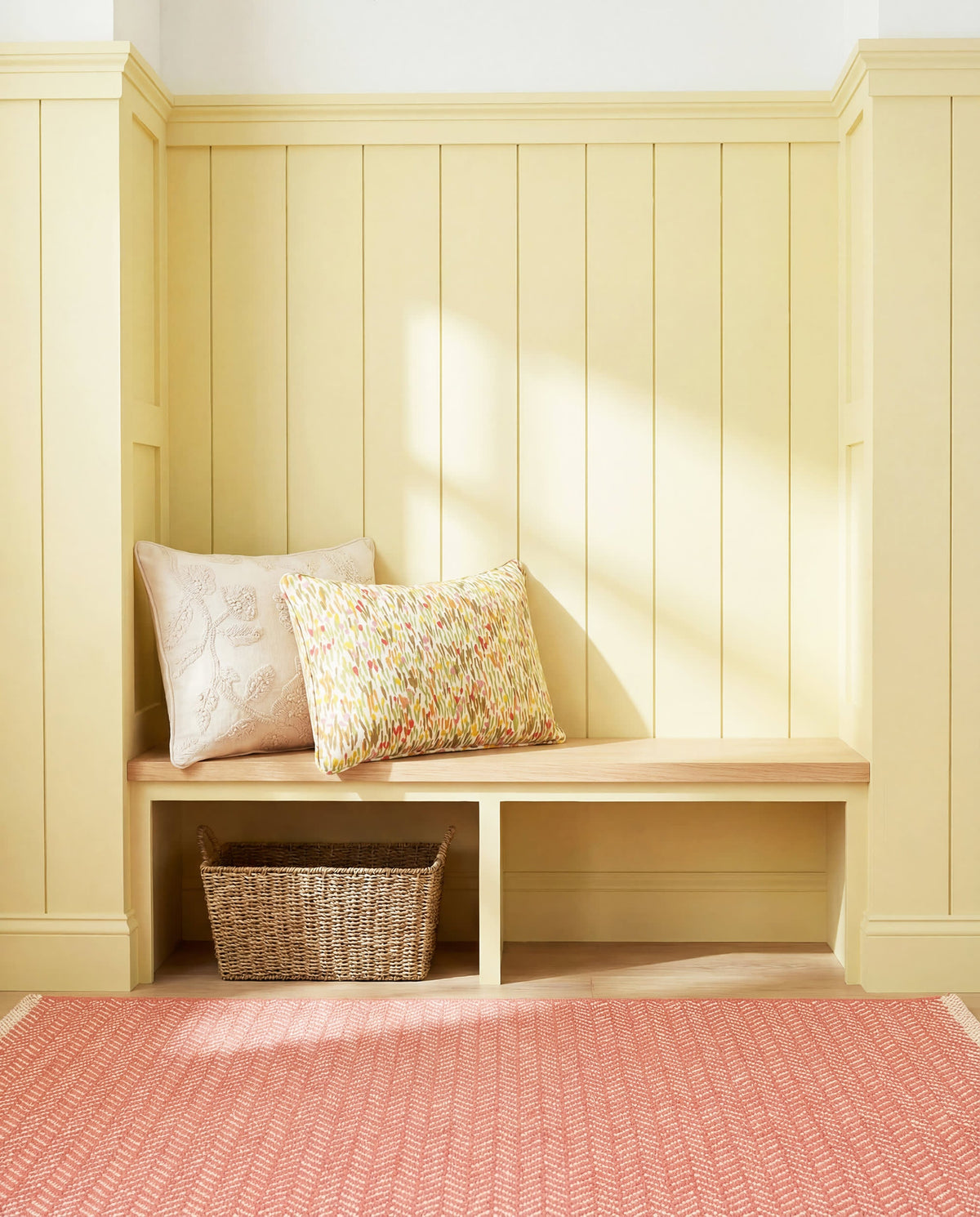 Dash & Albert Herringbone Handwoven Cotton Rug in Coral, window seat setting
