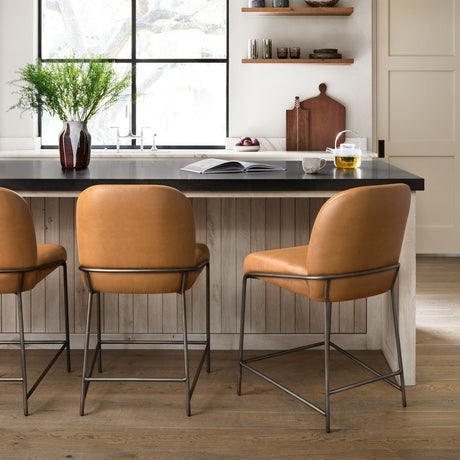 Four Hands leather counter stools at a kitchen island