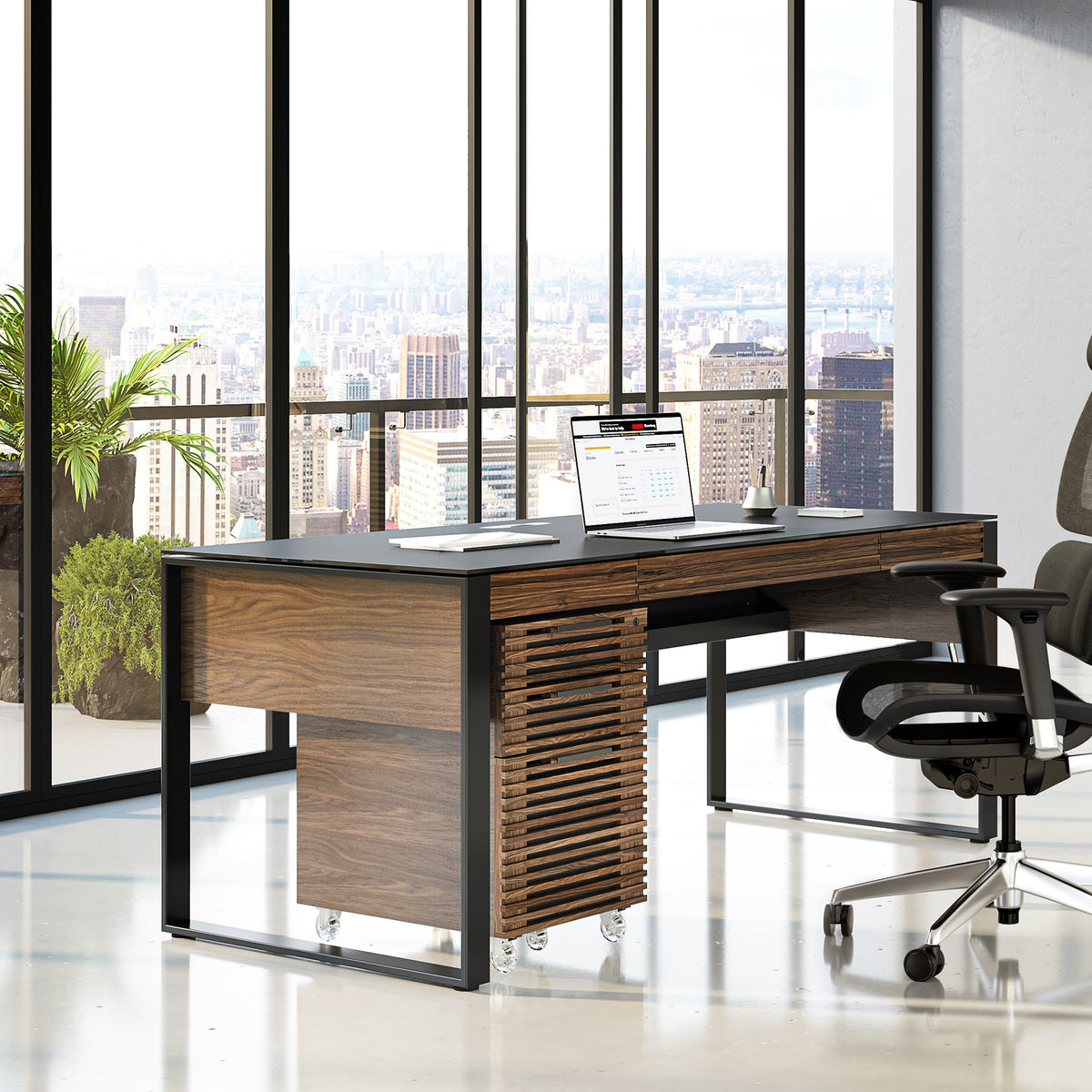 BDi Corridor 6507 Mobile File Cabinet in Natural Walnut, under a desk in a city office