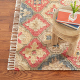 Dash & Albert Pali Handwoven Jute Rug in Multicolour, corner with a stool