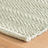 Dash & Albert Herringbone Handwoven Cotton Rug in Ocean, corner detail