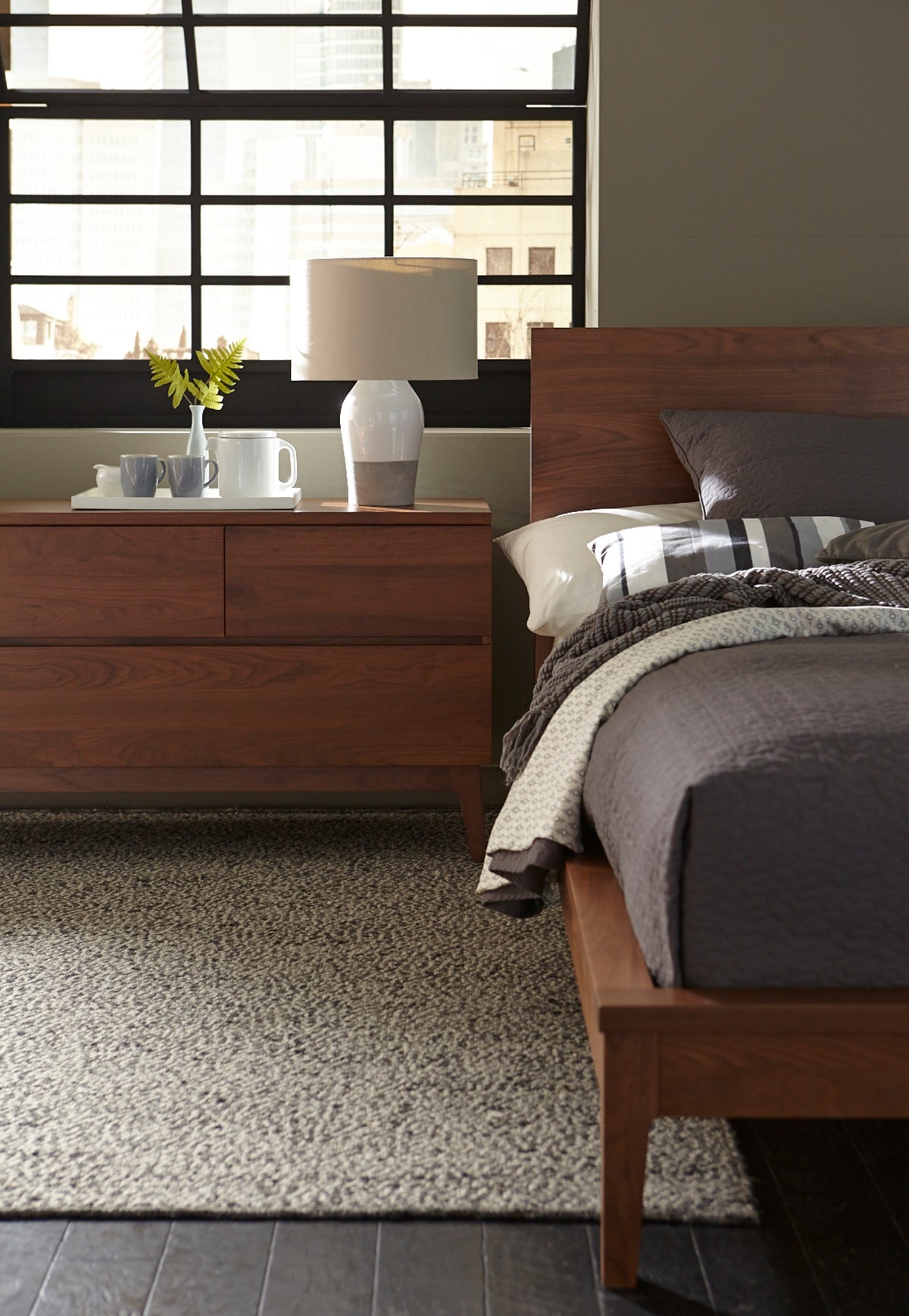 West Bros Serra Platform Bed in 80 Walnut, angled view in a room setting