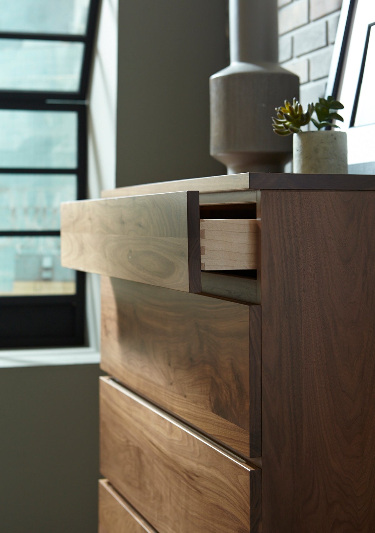 West Bros Serra Chest of Drawers in 80 Walnut, with a drawer open
