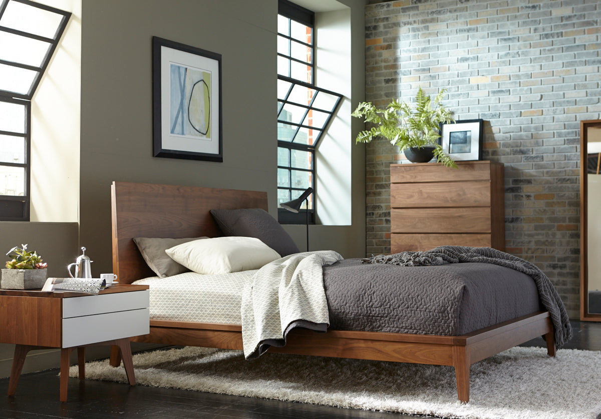 West Bros Serra Night Table in 80 Walnut, beside the bed in a room setting, Mist lacquer fronts