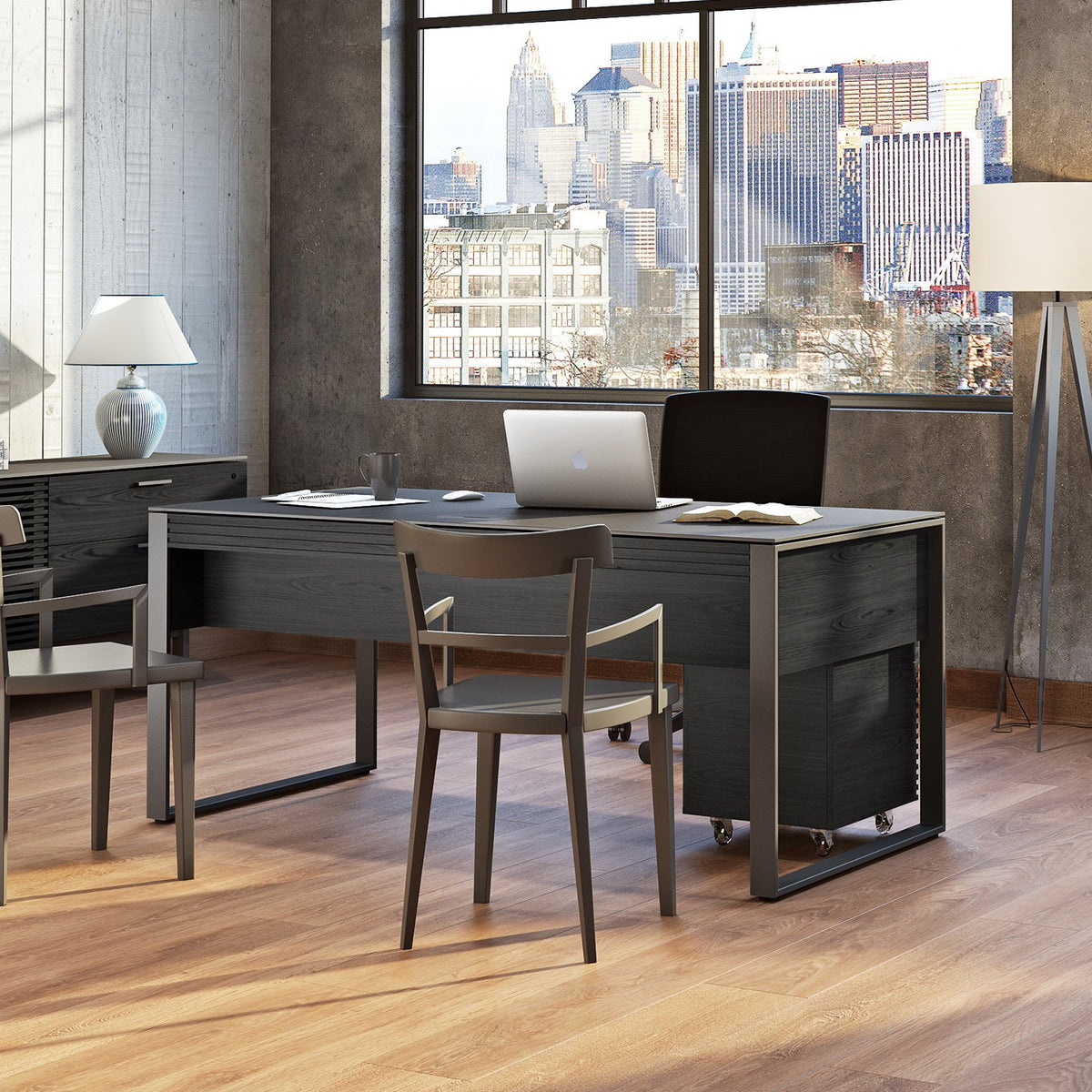 BDi Corridor 6521 Executive Office Desk in Charcoal Stained Ash, seen from the guest side with two chairs, in a loft office