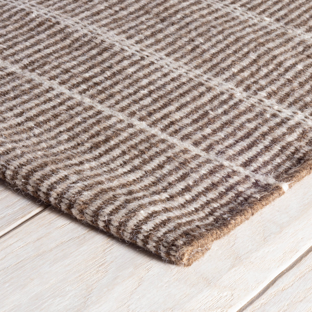 Dash & Albert Samson Handwoven Indoor/Outdoor Rug in Oak, corner detail