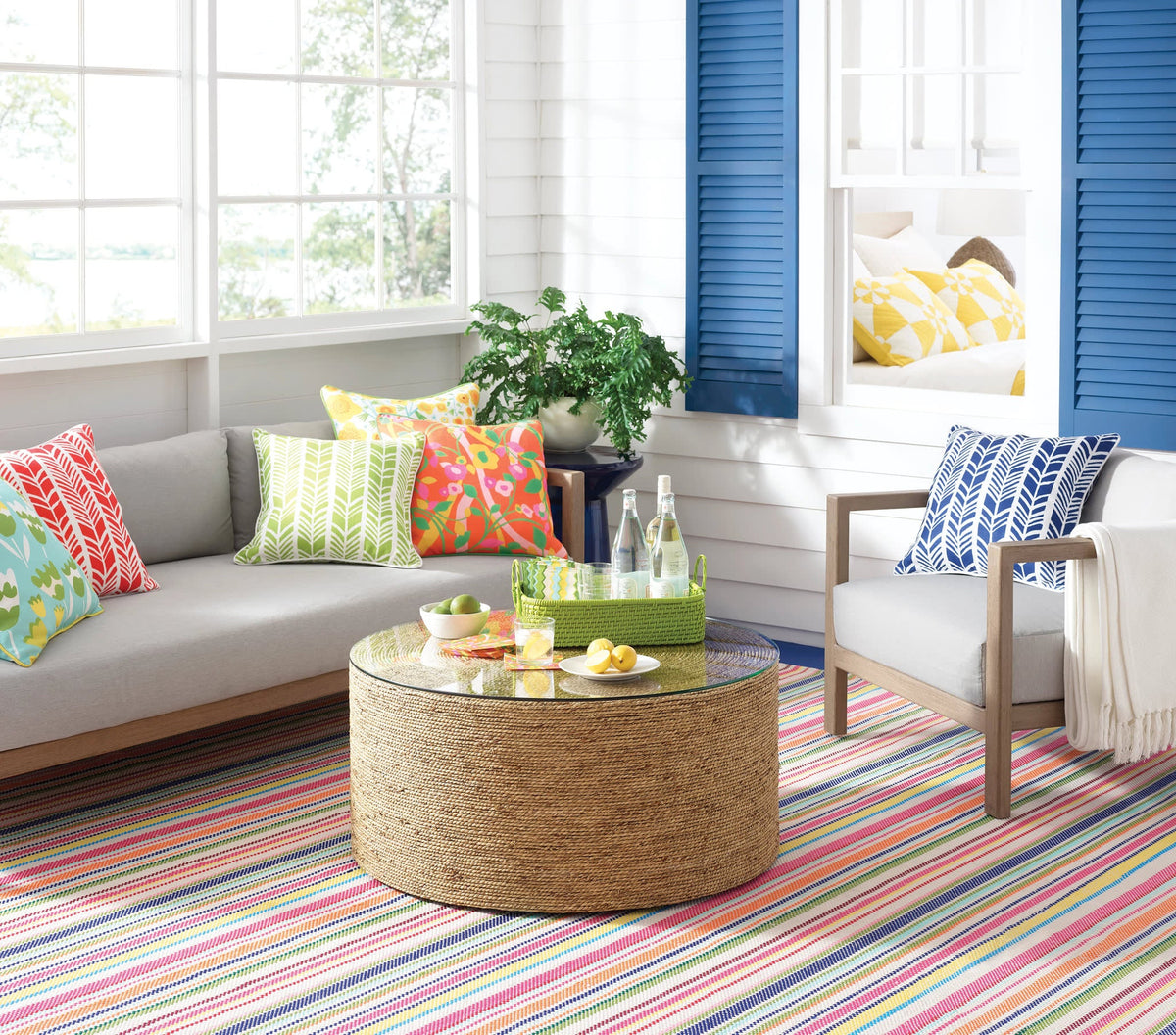 Dash & Albert Summer Stripe Handwoven Indoor/Outdoor Rug in Multi, sunroom setting