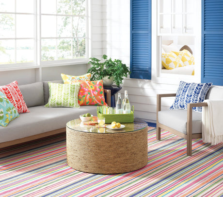 Dash & Albert Summer Stripe Handwoven Indoor/Outdoor Rug in Multi, sunroom setting