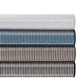 Dash & Albert Samson Machine Washable Rug in Grey, Navy, Oak and Black, rolled stack